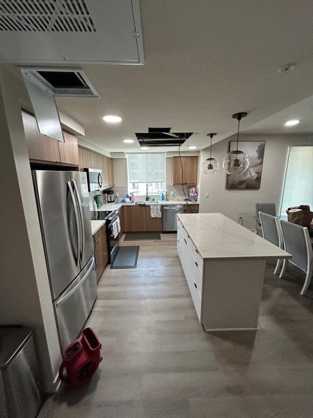 Kitchen with structural drying equipment running